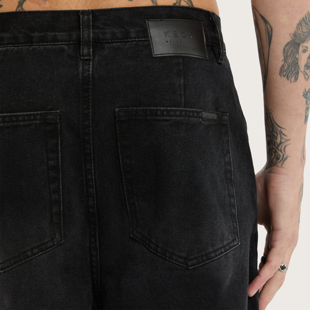 Model wears K8 Balloon Jean Vintage Black Pants in Black - Image 7