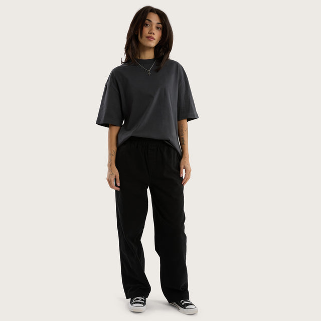 Model wears Diablo Baggy Pant Jet Black Pants in Black - Image 4