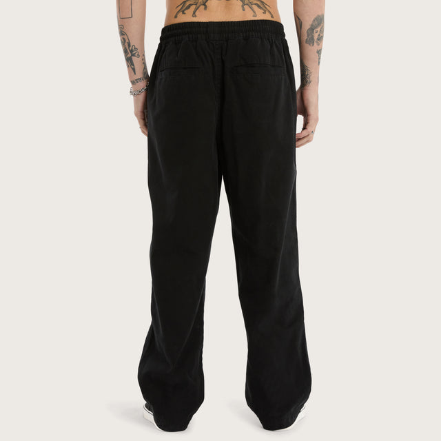 Model wears Diablo Baggy Pant Jet Black Pants in Black - Image 6