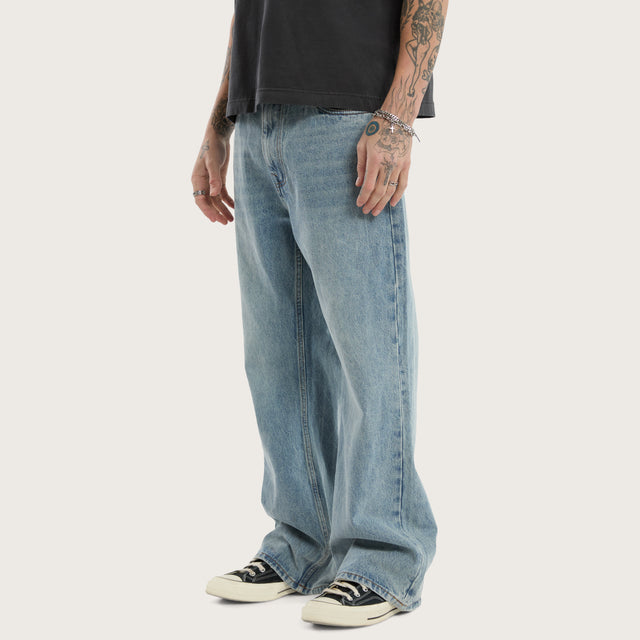 Model wears Wilder Bootcut Jean Baja Blue Pants in Blue - Image 3