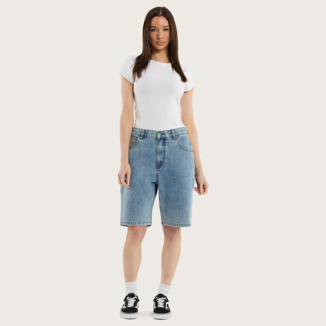 Model wears K6 Denim Jort Trashed Blue Shorts in 0 - Image 6