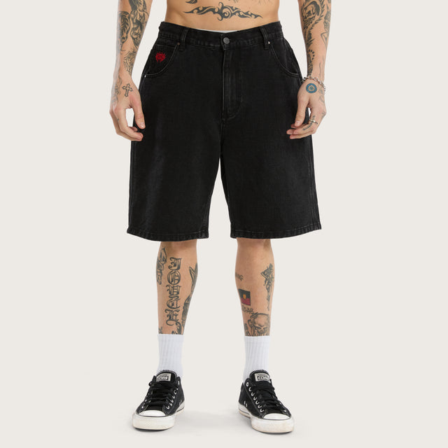 Model wears K6 Denim Jort Worn Black Shorts in Black - Image 4