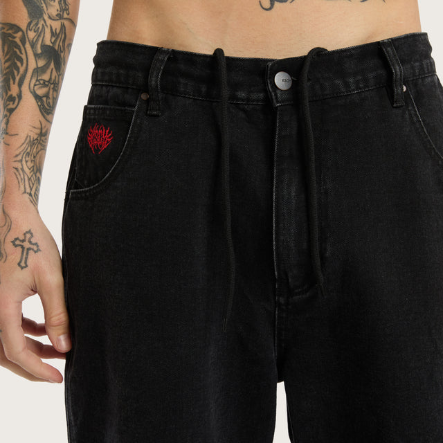 Model wears K6 Denim Jort Worn Black Shorts in Black - Image 5