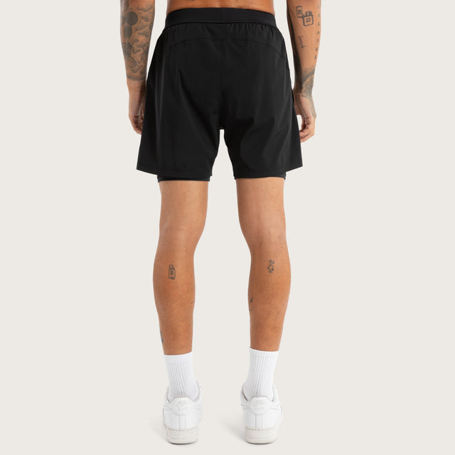 Model wears Hybrid 2.0 Sport Short Jet Black Shorts in Black - Image 5