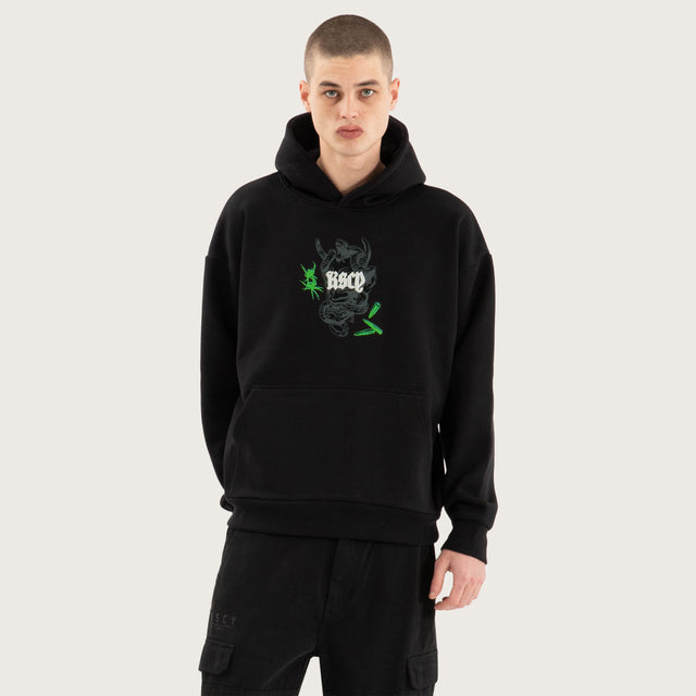 Model wears Wither Oversized Hoodie Jet Black Hoodies in Black - Image 4