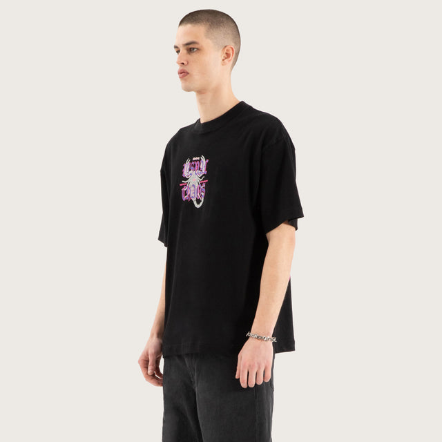 Model wears Scorpio Street Tee Jet Black T-Shirts in Black - Image 6