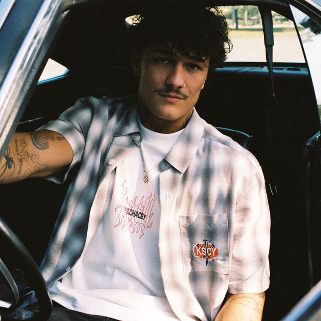 Model wears Titan Skate Shirt Iron White Check Short Sleeve Shirts in White - Image 2