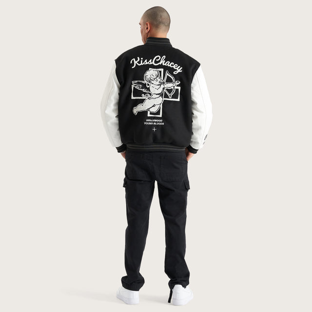 Model wears Code Vein Varsity Jacket Jet Black Jackets in Black - Image 5