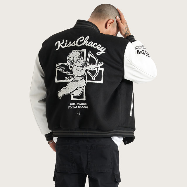 Model wears Code Vein Varsity Jacket Jet Black Jackets in Black - Image 1