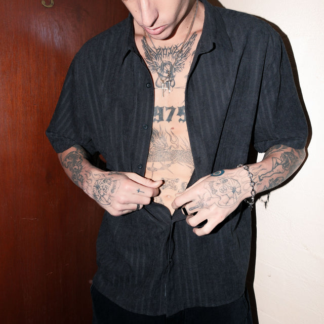 Model wears Solemn Shortsleeve Shirt Jet Black Short Sleeve Shirts in Black - Image 2