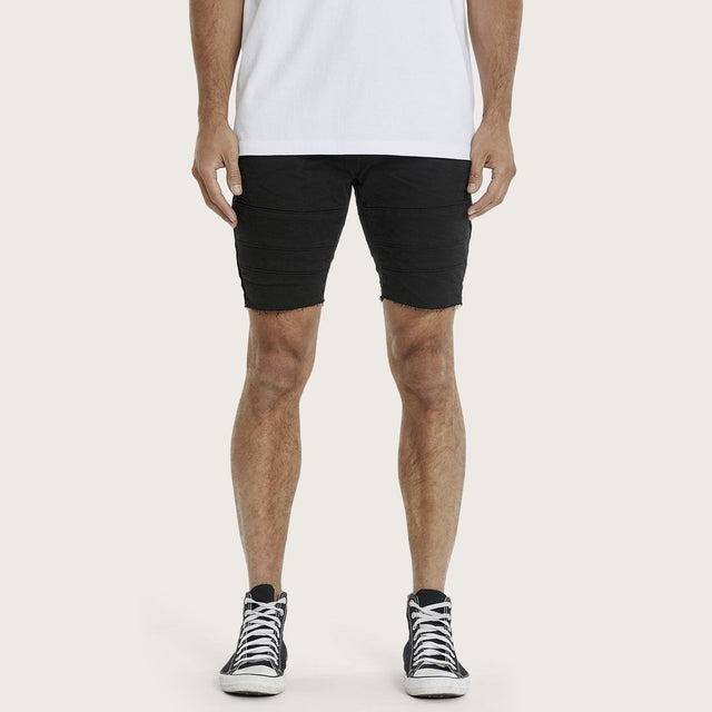 Model wears Arcadia Short Jet Black Shorts in Black - Image 1