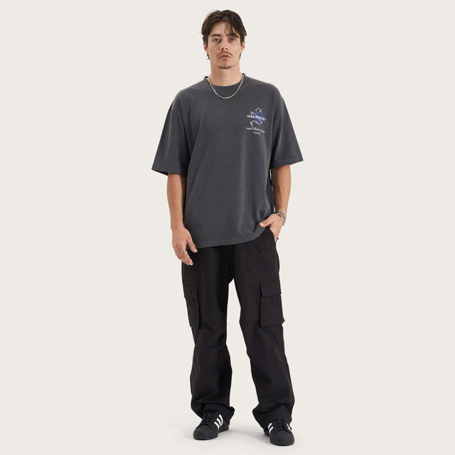 Model wears Confined Heavy Oversized Tee Pigment Black T-Shirts in Black - Image 6