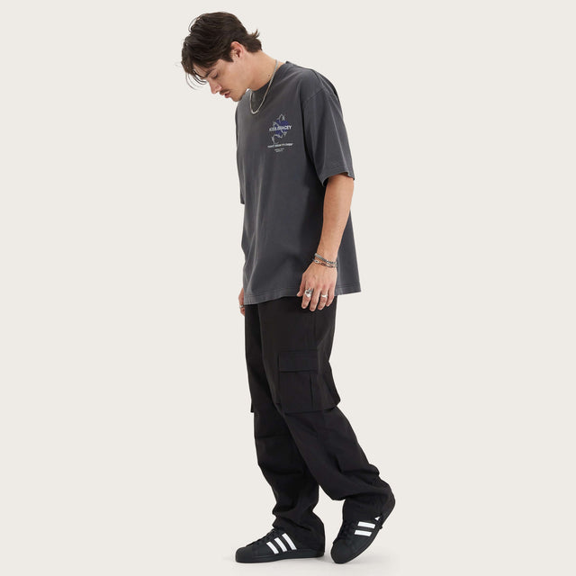 Model wears Confined Heavy Oversized Tee Pigment Black T-Shirts in Black - Image 7