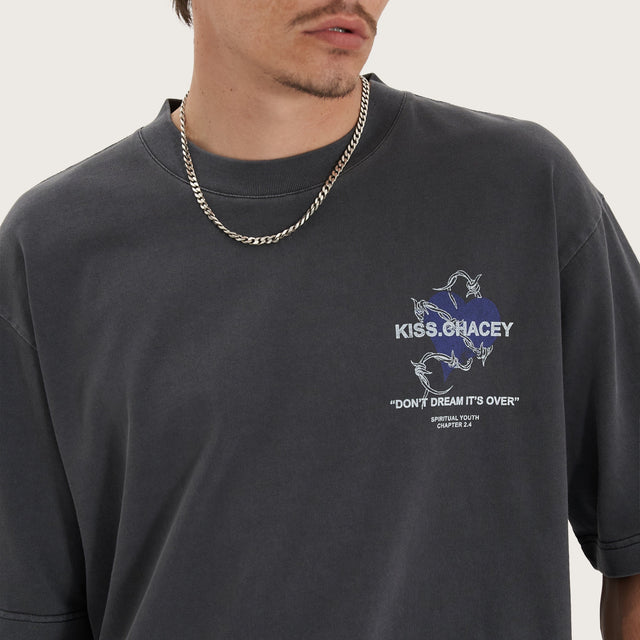 Model wears Confined Heavy Oversized Tee Pigment Black T-Shirts in Black - Image 5