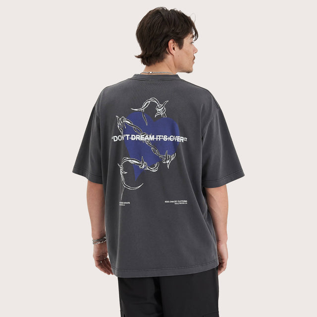Model wears Confined Heavy Oversized Tee Pigment Black T-Shirts in Black - Image 1