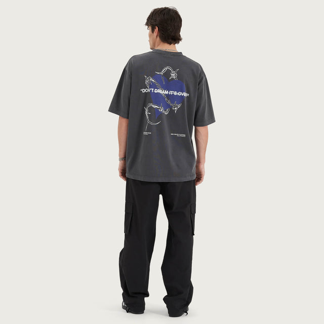 Model wears Confined Heavy Oversized Tee Pigment Black T-Shirts in Black - Image 8