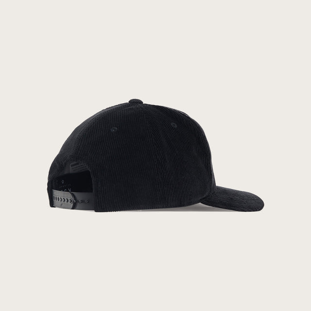 Model wears Crossroad 110 Cap Jet Black Headwear in Black - Image 2