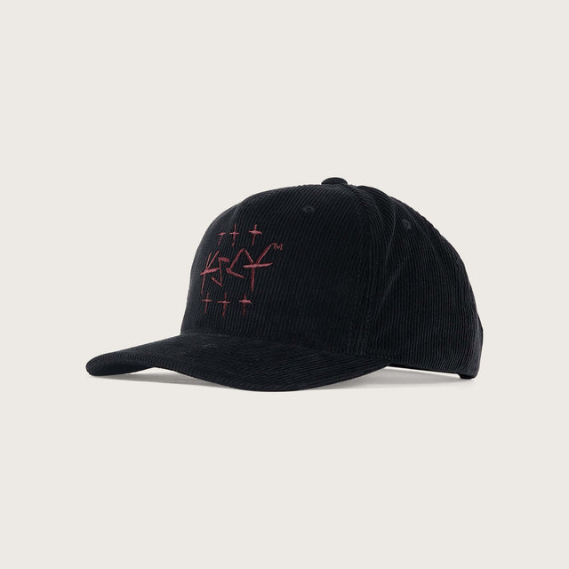 Model wears Crossroad 110 Cap Jet Black Headwear in Black - Image 1