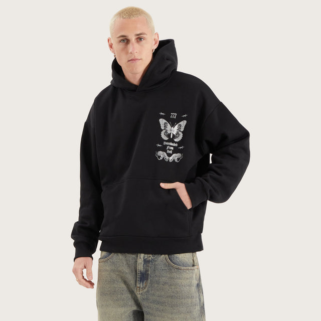 Model wears Download Oversized Hoodie Jet Black Hoodies in Black - Image 2