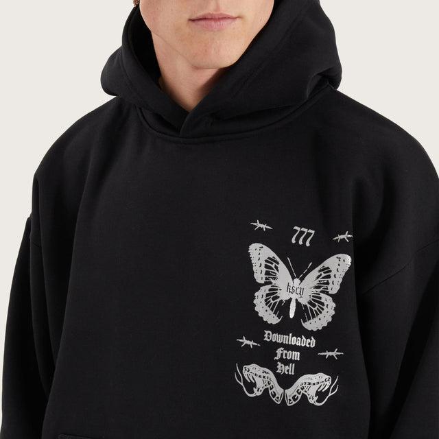 Model wears Download Oversized Hoodie Jet Black Hoodies in Black - Image 4