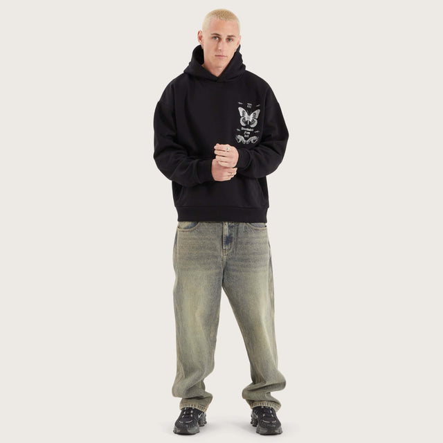 Model wears Download Oversized Hoodie Jet Black Hoodies in Black - Image 7
