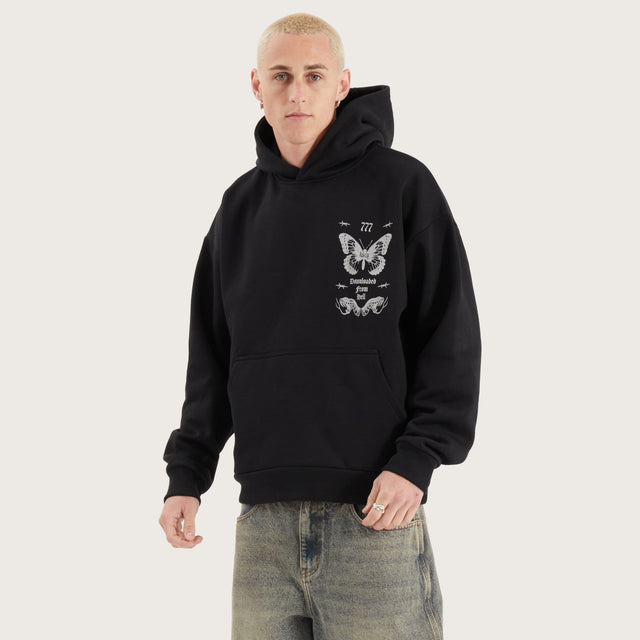 Model wears Download Oversized Hoodie Jet Black Hoodies in Black - Image 9