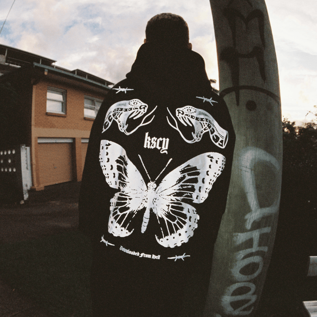 Model wears Download Oversized Hoodie Jet Black Hoodies in Black - Image 3