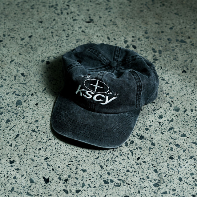 Model wears Triton Dad Cap Asphalt Caps in Grey - Image 2