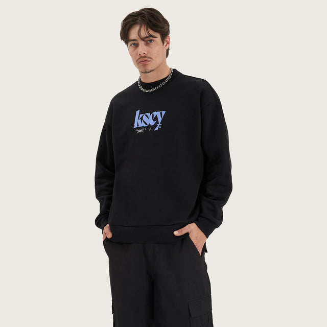 Model wears Evolved Heavy Relaxed Sweater Jet Black Jumpers in Black - Image 2