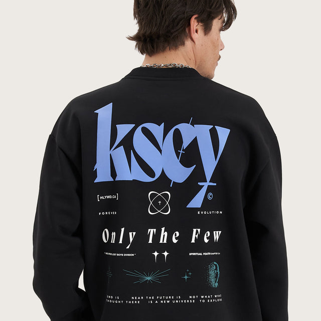 Model wears Evolved Heavy Relaxed Sweater Jet Black Jumpers in Black - Image 4
