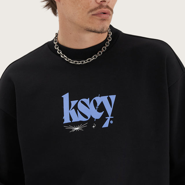Model wears Evolved Heavy Relaxed Sweater Jet Black Jumpers in Black - Image 5
