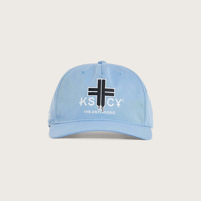 Model wears Foundation Golfer Cap Corn Flower Headwear in Blue - Image 1