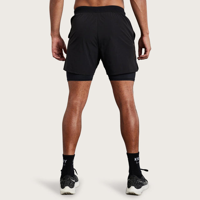 Model wears Hybrid Elasticated Short with Lining Black Shorts in Black - Image 9