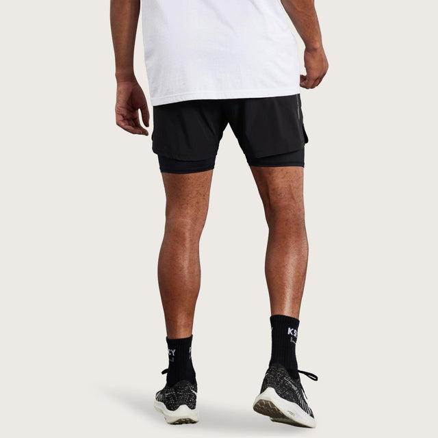 Model wears Hybrid Elasticated Short with Lining Black Shorts in Black - Image 6