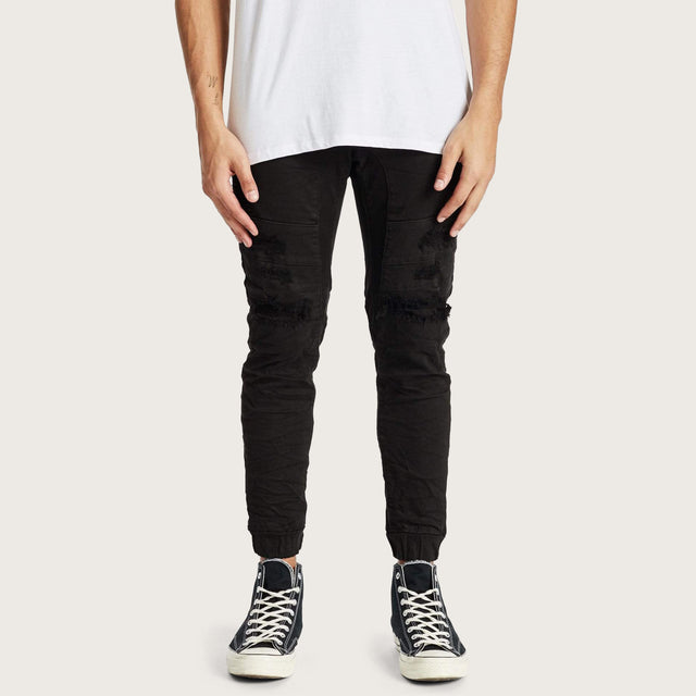 Model wears Hydra Denim Jogger Jet Black Pants in Black - Image 2