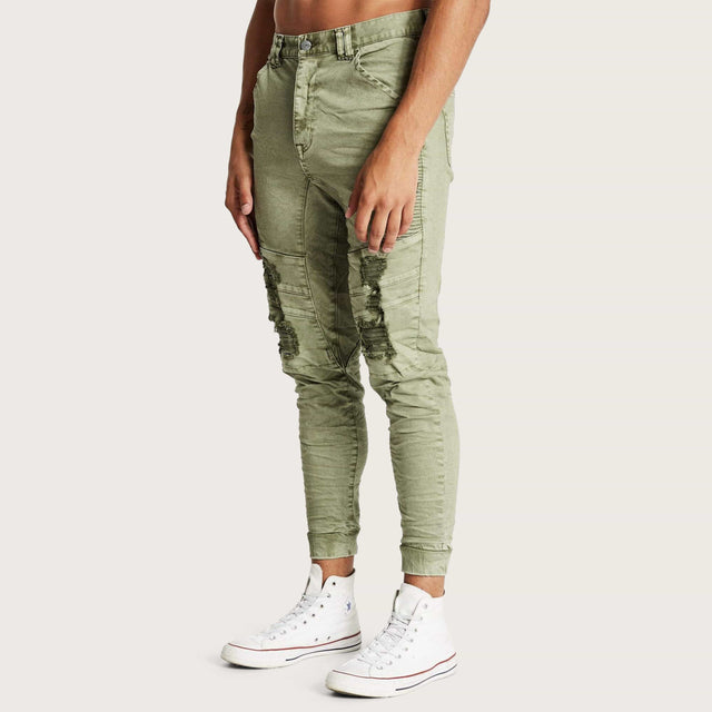 Model wears Hydra Denim Jogger Lichen Green Pants in Green - Image 2