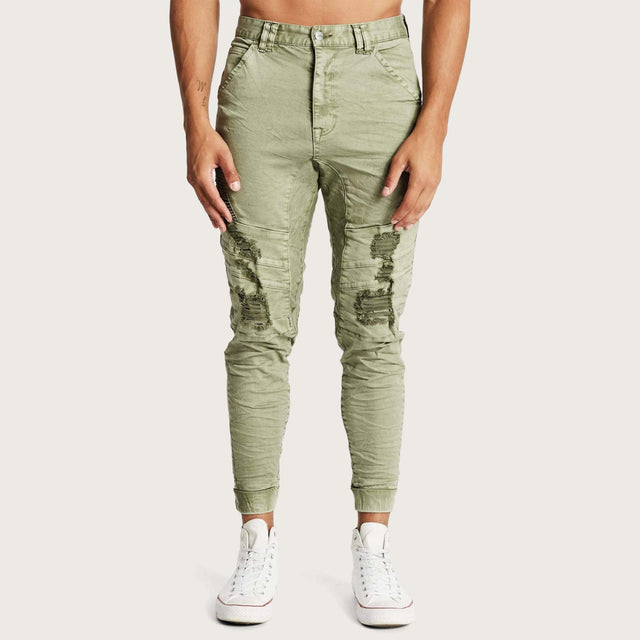 Model wears Hydra Denim Jogger Lichen Green Pants in Green - Image 3