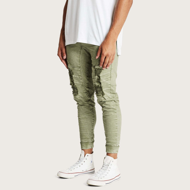 Model wears Hydra Denim Jogger Lichen Green Pants in Green - Image 5