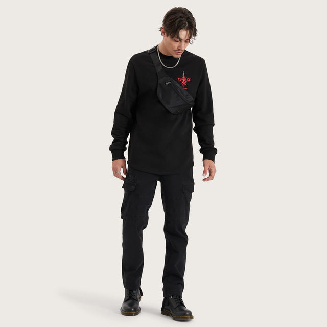 Model wears Inferno Heavy Dual Curved Sweater Jet Black Jumpers in Black - Image 4