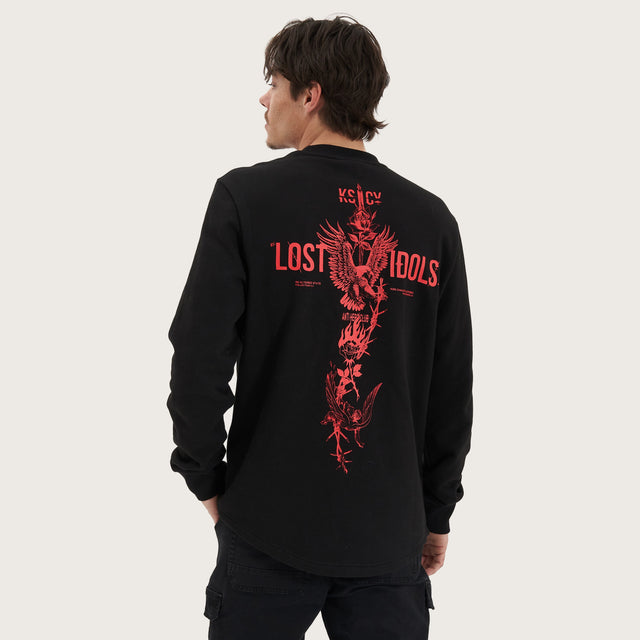 Model wears Inferno Heavy Dual Curved Sweater Jet Black Jumpers in Black - Image 1