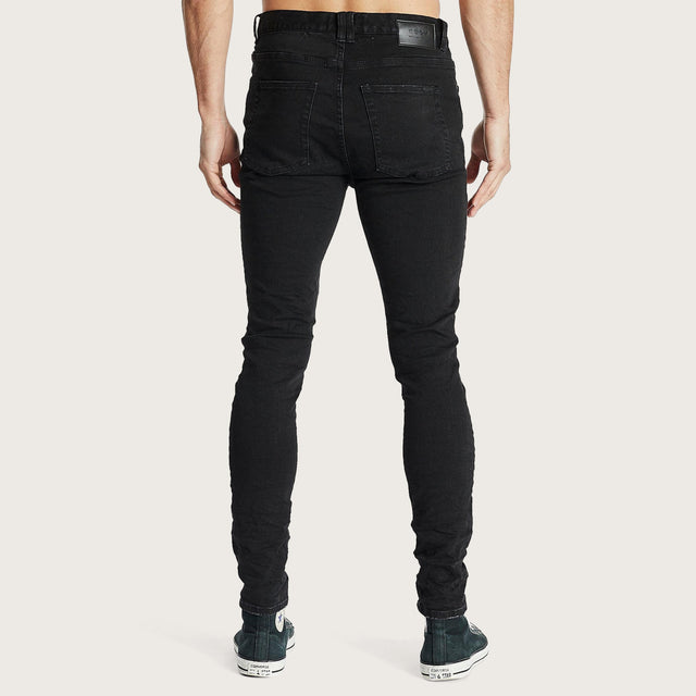 Model wears K1 Super Skinny Fit Jean Destroyed Washed Black Pants in Black - Image 5