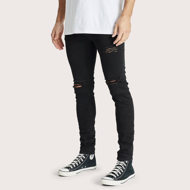 Model wears K1 Super Skinny Fit Jean Destroyed Washed Black Pants in Black - Image 2