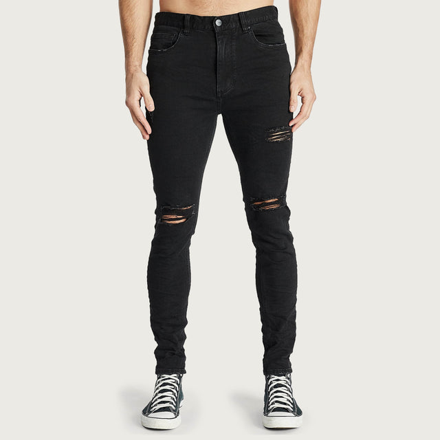 Model wears K1 Super Skinny Fit Jean Destroyed Washed Black Pants in Black - Image 4