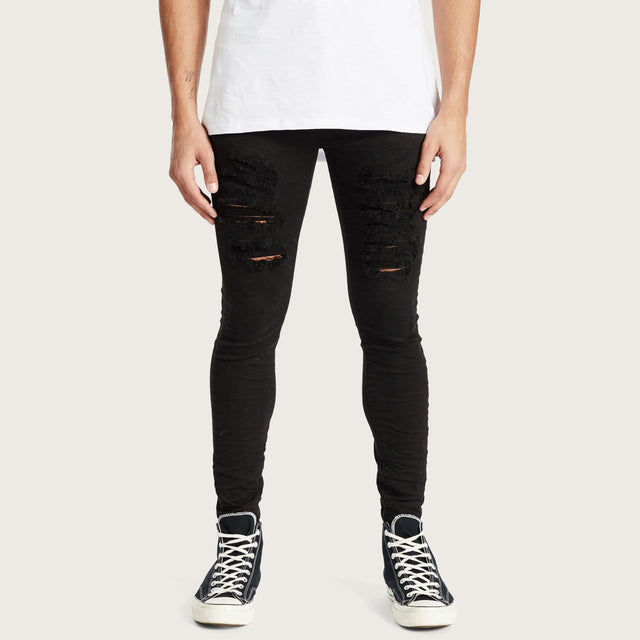 Model wears K1 Super Skinny Jeans Destroyed Black Pants in Black - Image 2