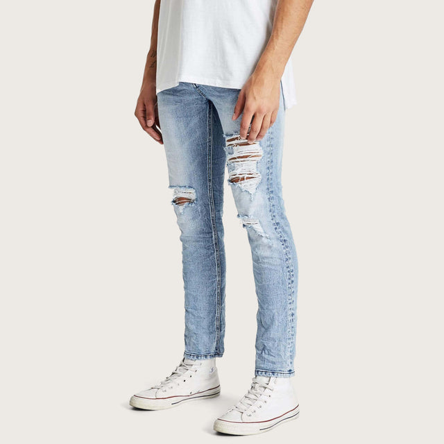 Model wears K2 Skinny Jean Worn'N'Torn Pants in Blue - Image 2
