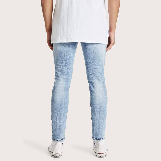 Model wears K2 Skinny Jean Worn'N'Torn Pants in Blue - Image 6