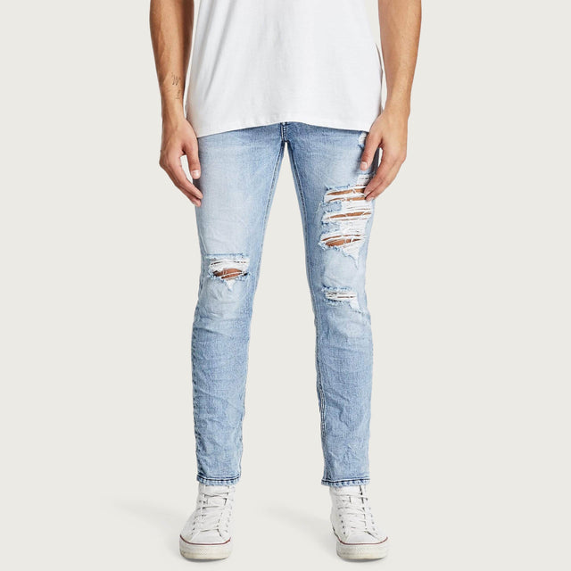 Model wears K2 Skinny Jean Worn'N'Torn Pants in Blue - Image 1