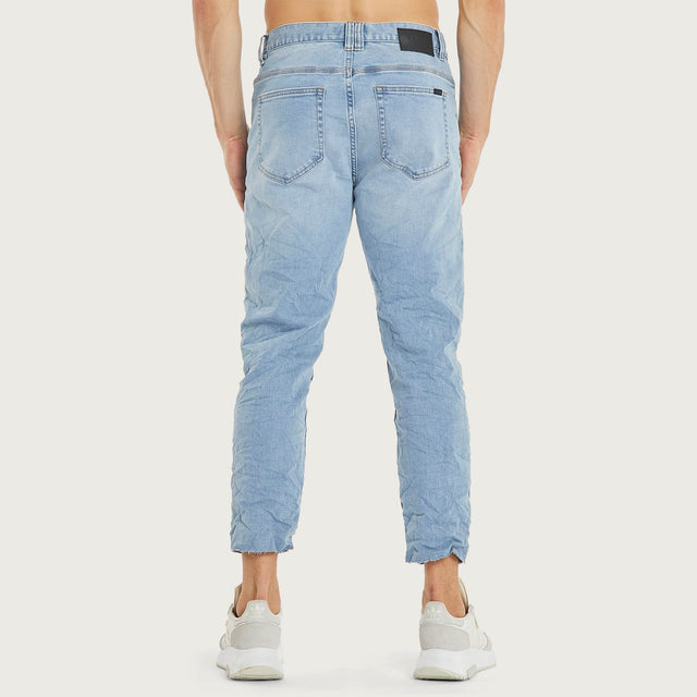 Model wears K5 Slim Cropped Jean Arcade Blue Pants in Blue - Image 5