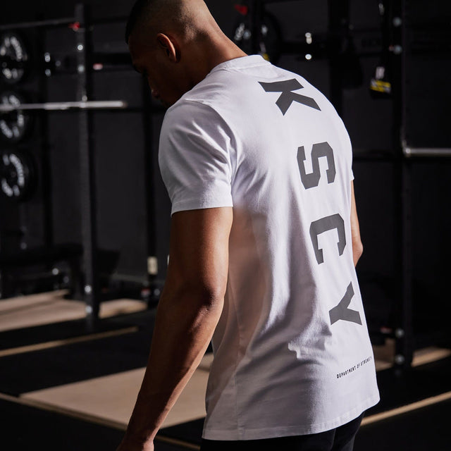 Model wears Motion Active T-Shirt White T-Shirts in White - Image 3