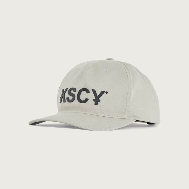Model wears Motion Golfer Cap Dove Headwear in White - Image 1